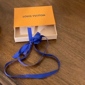 Louis Vuitton gift box with ribbon.